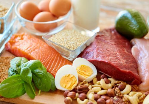 Protein-rich whole foods including eggs, salmon, nuts and seeds to support liver function and hormone balance during menopause